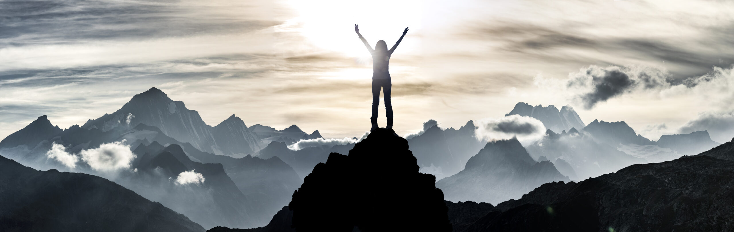 Woman standing at a summit